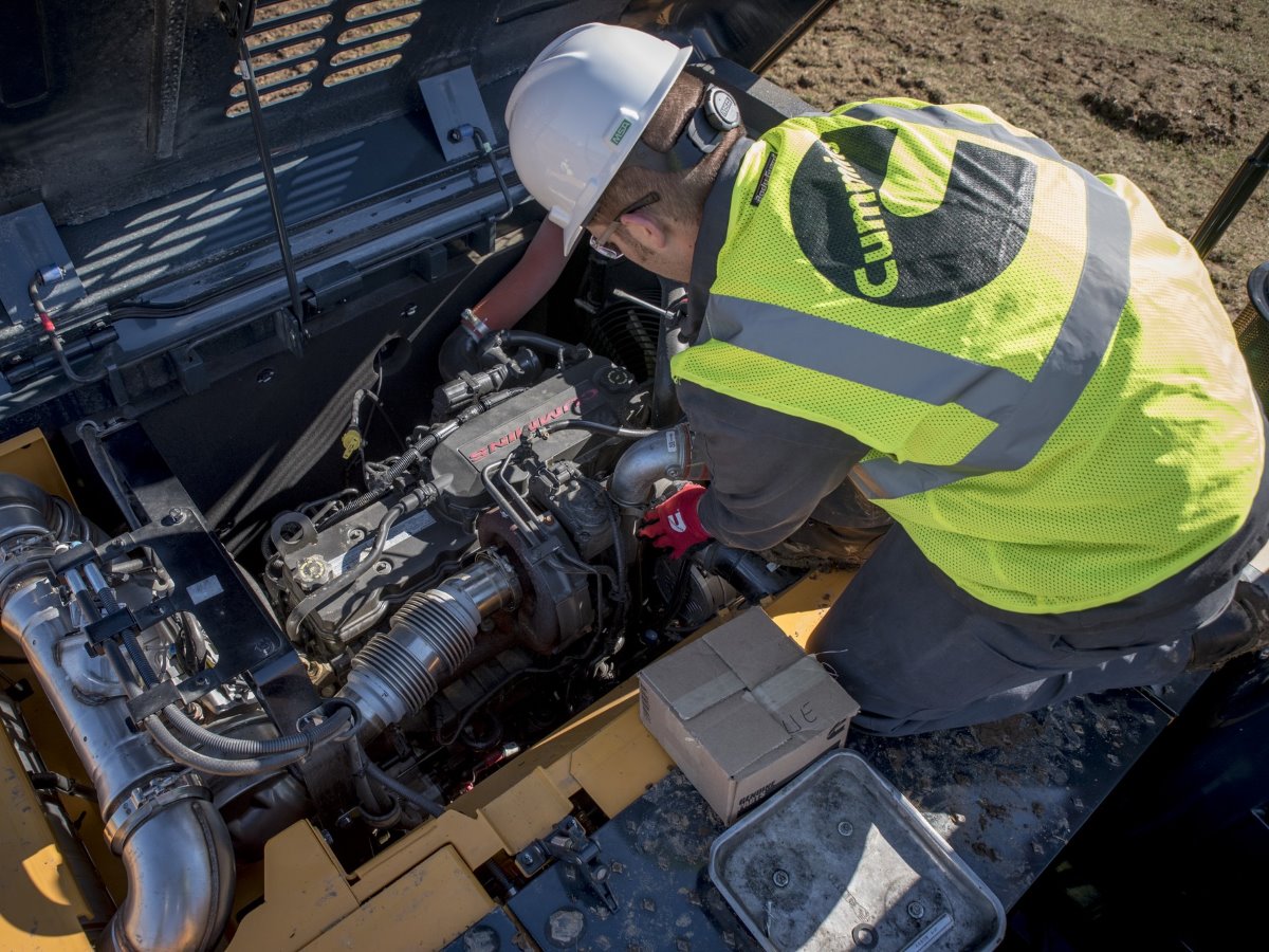 service technician working on engine