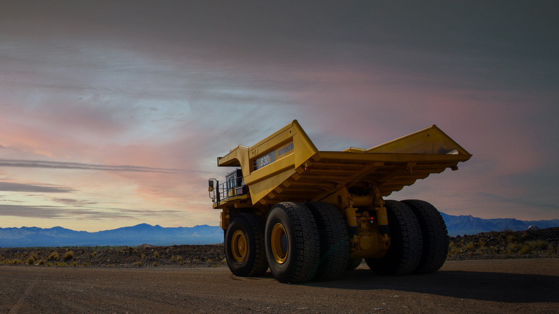 Mining dump truck parked while the sun is setting