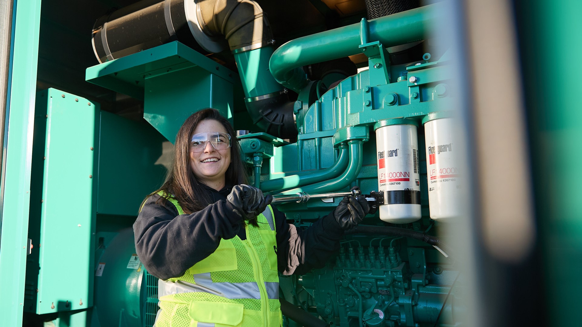 Mechanic providing service to a Cummins power generation product