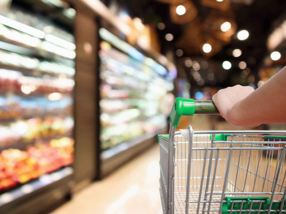 shopping cart in grocery store aisle