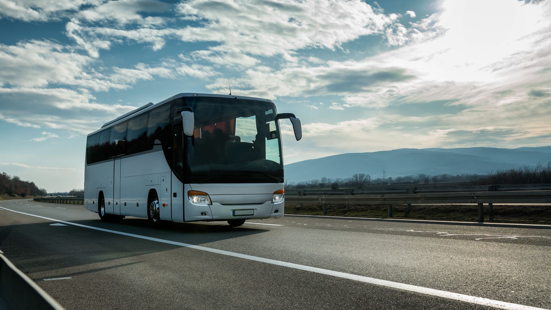 charter bus driving on road