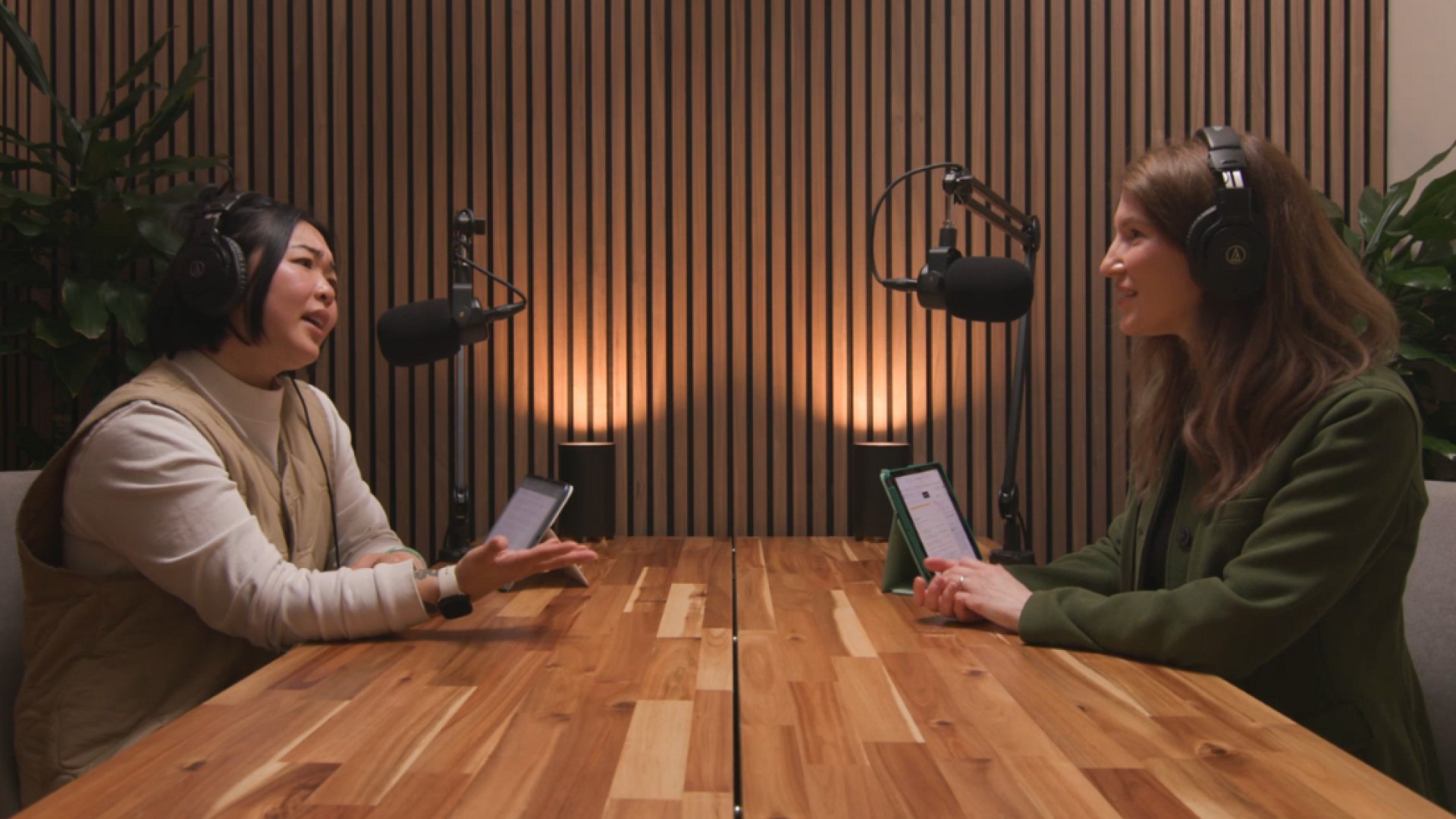 Two people talking on a podcast