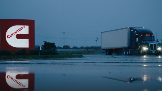 Cummins sign lit up while it's raining