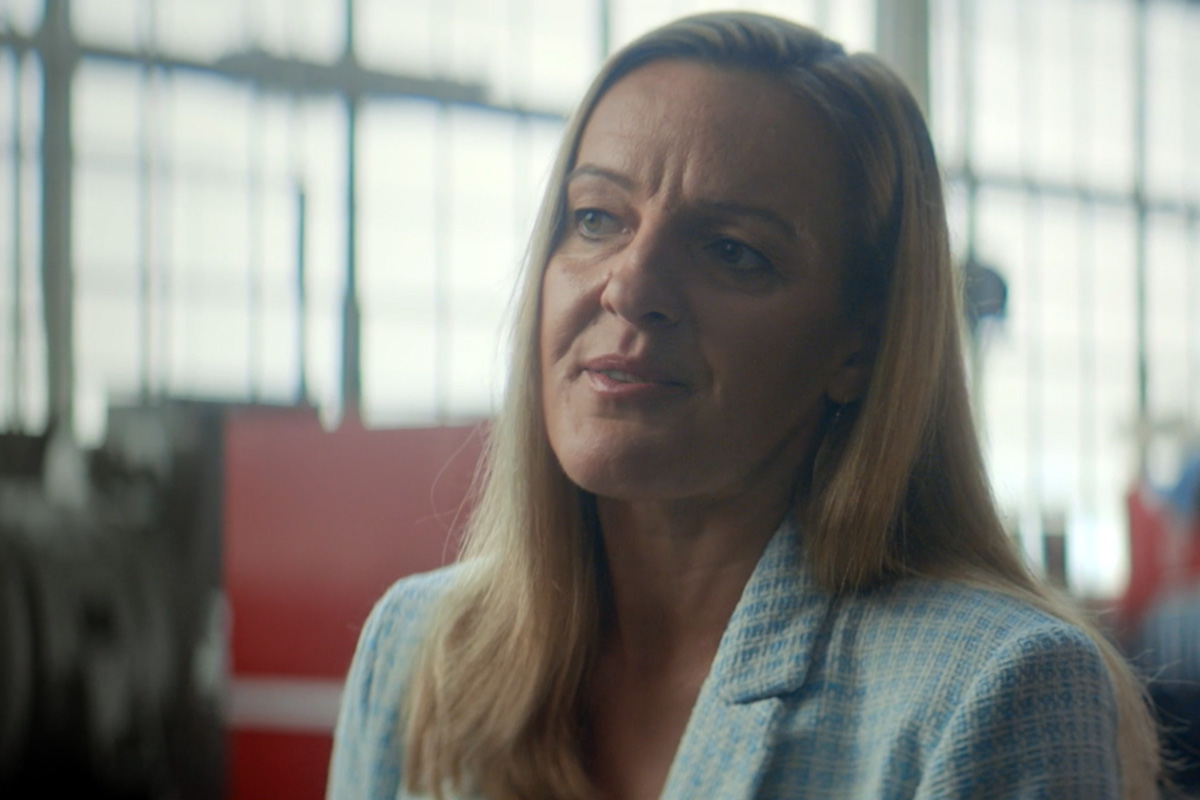 woman in warehouse talking about x10 engine