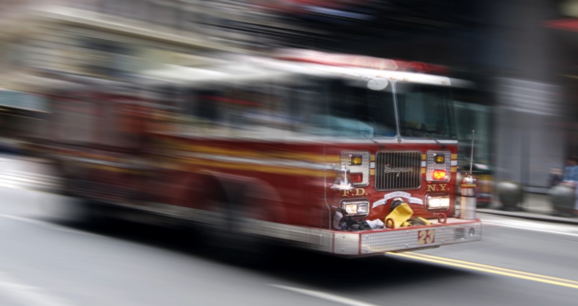Fire truck driving through a city street