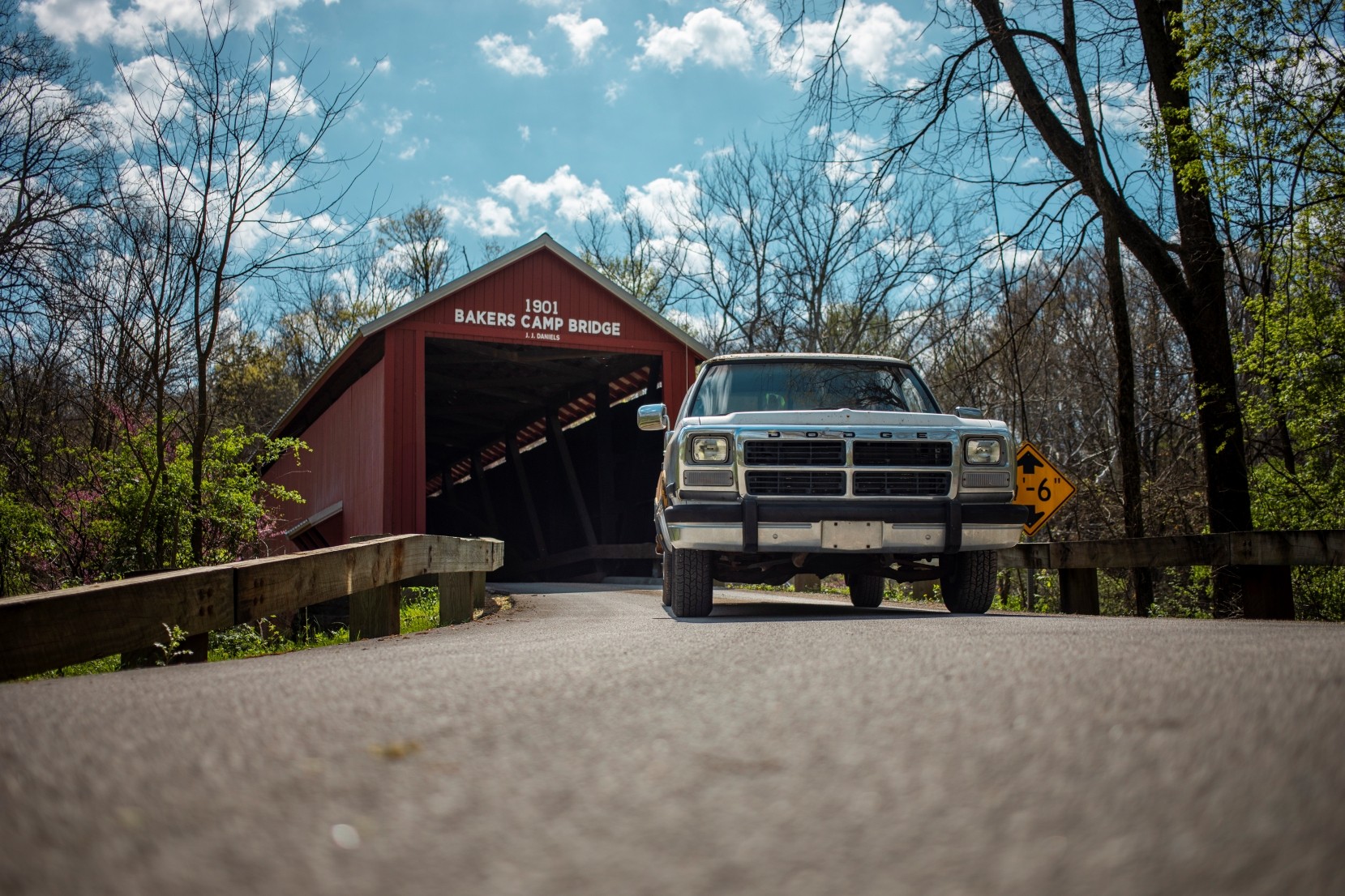 Pickup truck parked driving through the Bakers Camp covered bridge