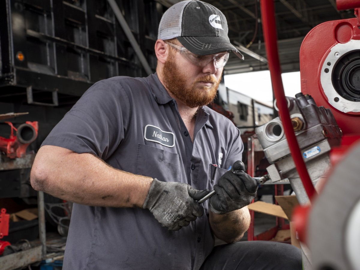 service tech working on engine