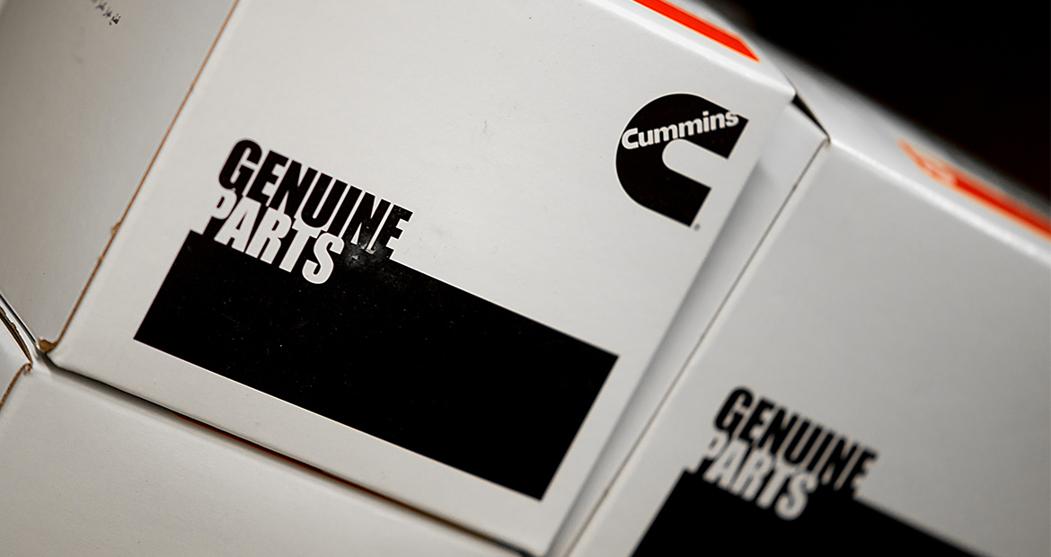 stack of Genuine Parts boxes
