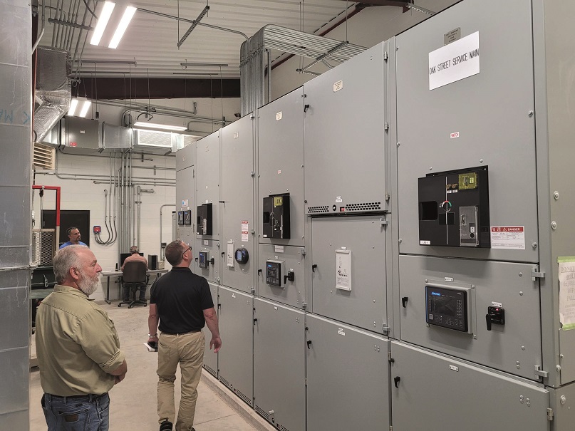 Workers near large cabinets