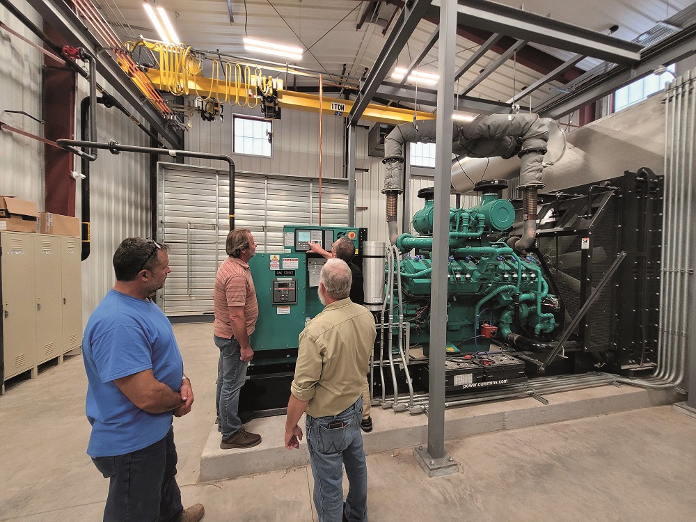 Workers standing inside of treatment facility