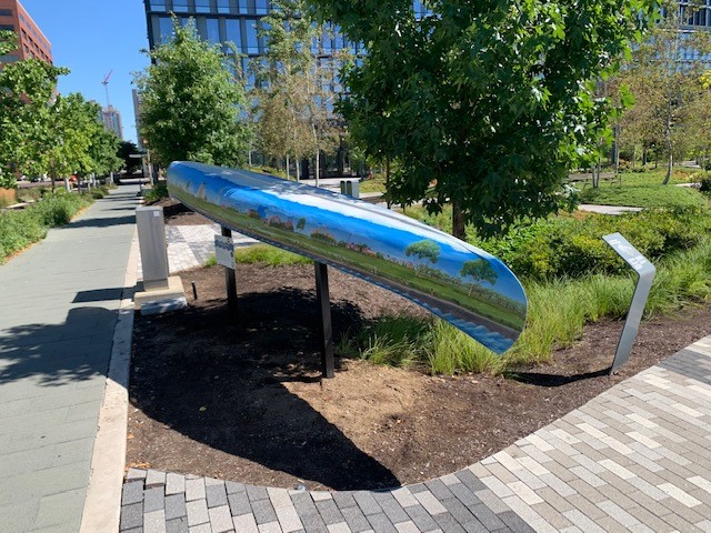 painted art canoe installation outside of Cummins office