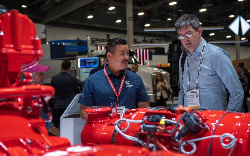People inspecting Cummins engines at the Las Vegas convention center