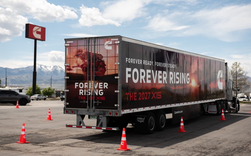 Forever Rising Tour branded Truck parked with traffic cones around it