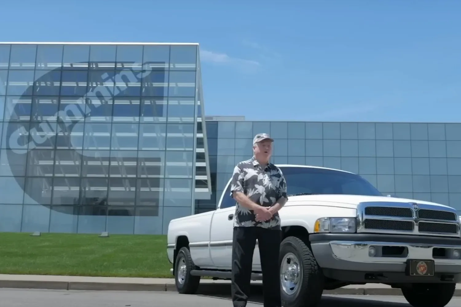 man standing next to pickup truck