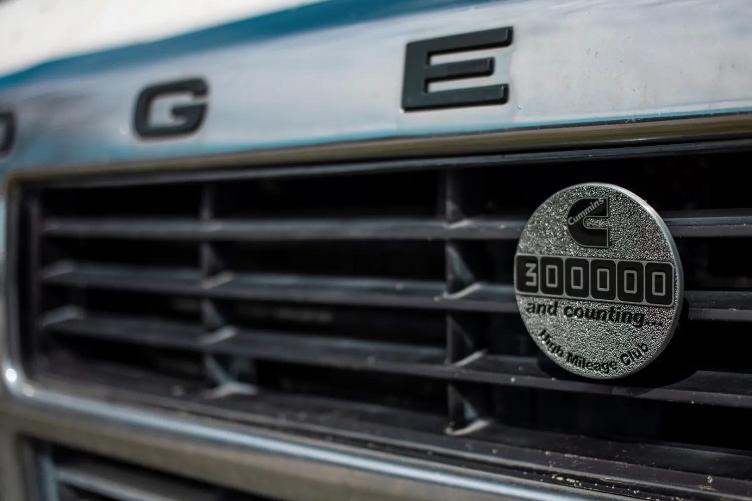 Cummins High Mileage Club badge on front of car