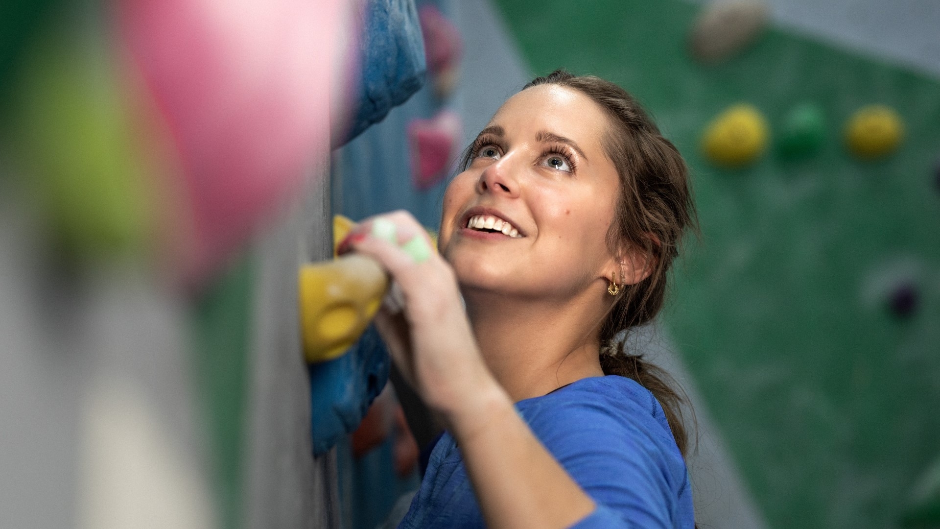 person climbing rock wall