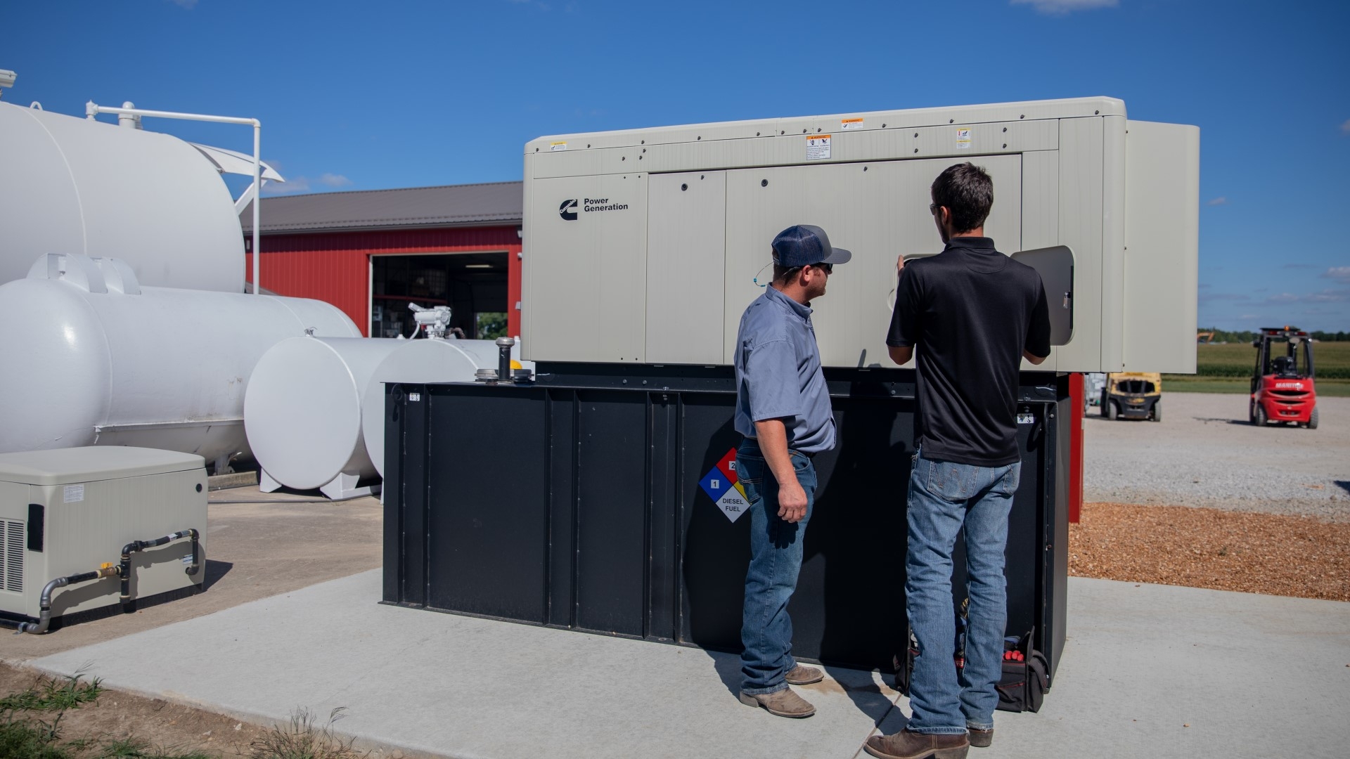People looking at a Cummins power gen product for commercial applications