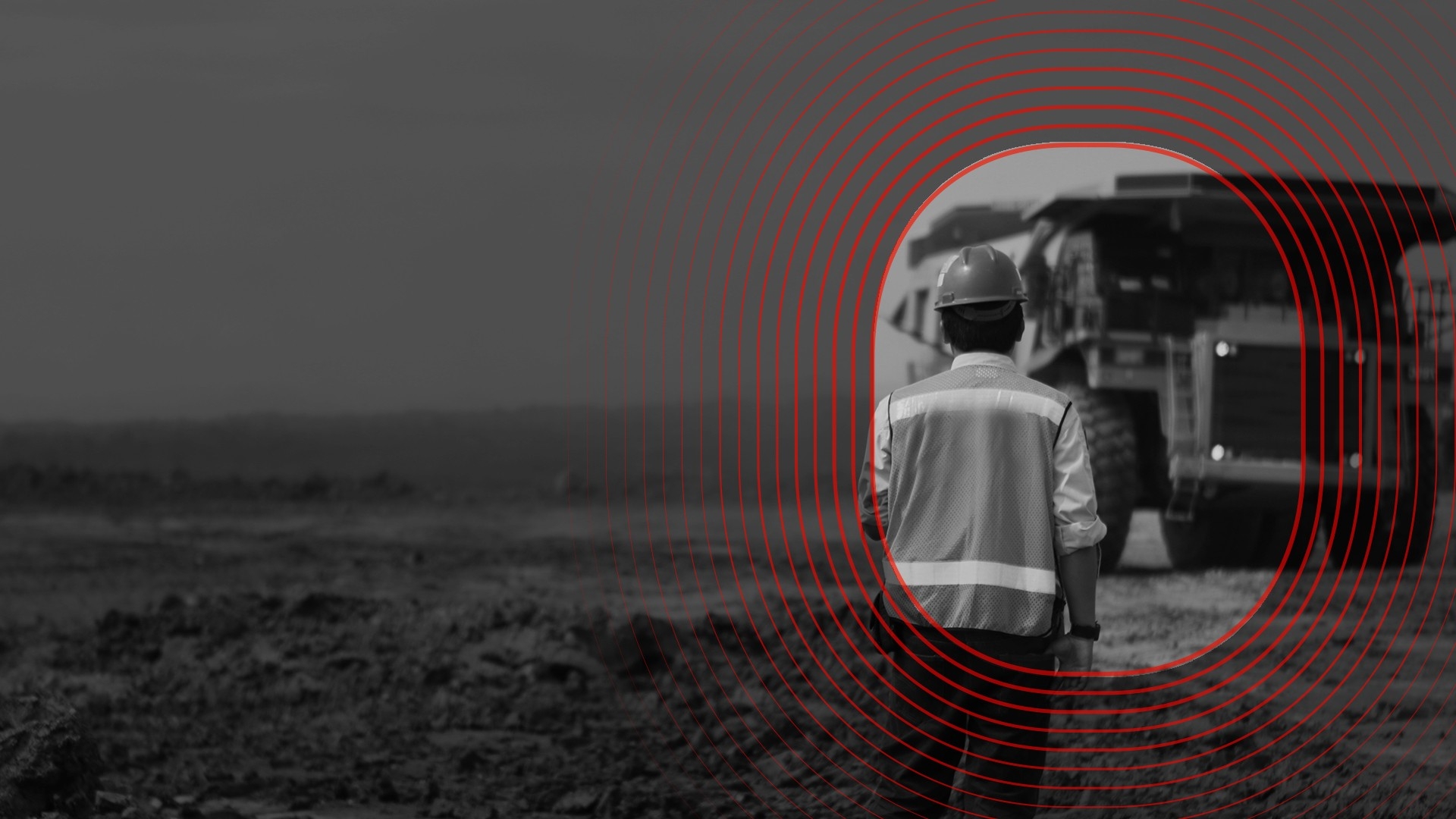 Miner looking at a dump truck