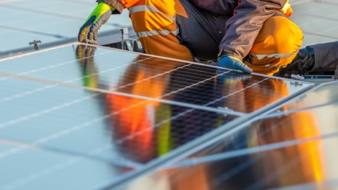 engineer installing solar panels