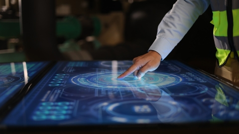 Construction worker using large touch pad device