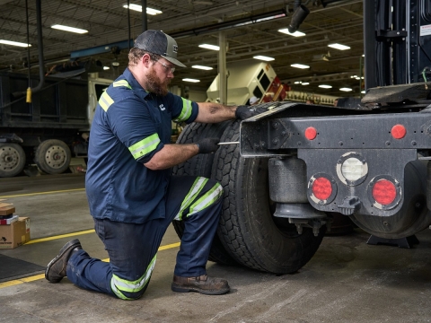 service technician working on brakes