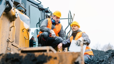 mining technicians on mining equipment