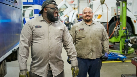 shop technicians with safety glasses and gloves on