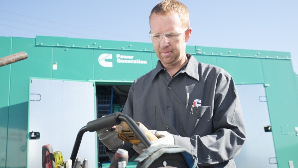 service technician working on generator set