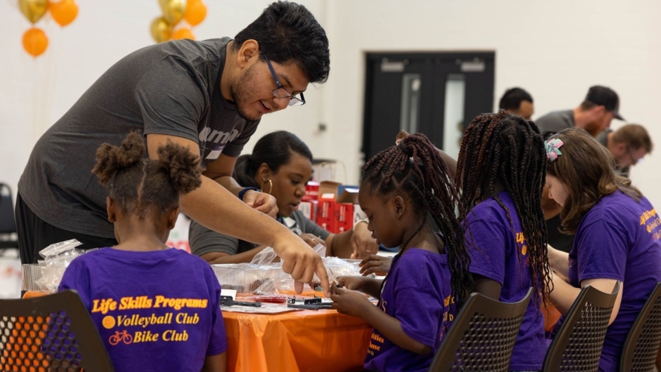 CARE members helping kids