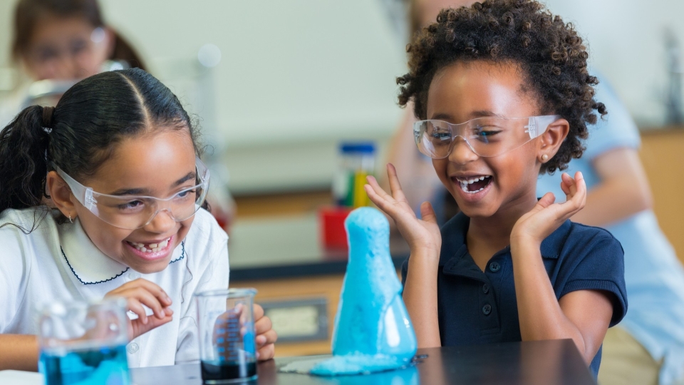 two young students in science class