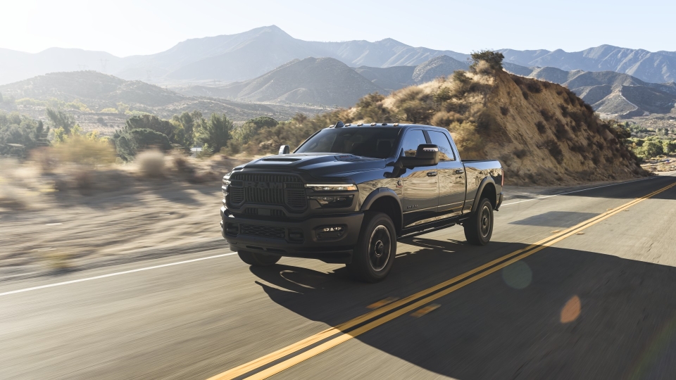 Ram truck driving on a road in the desert