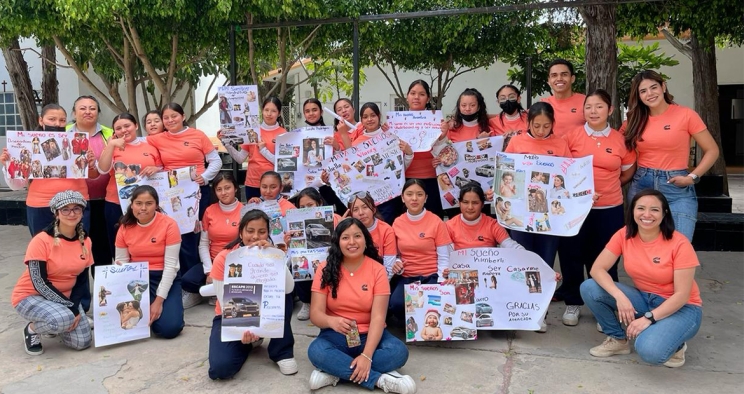 employees with students celebrating IWD