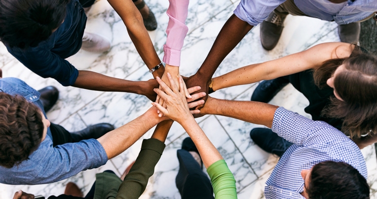 team huddle with hands