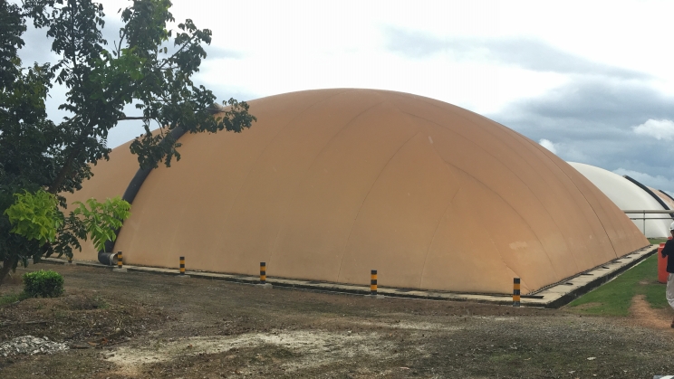 A covered lagoon used to trap methane from palm oil mill effluent and power a generator set