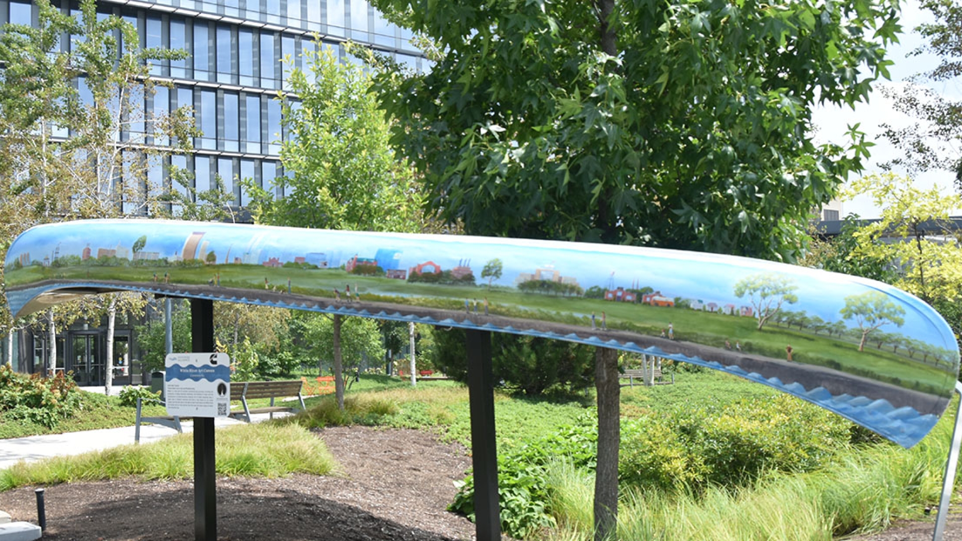 painted art canoe installation outside of Cummins office