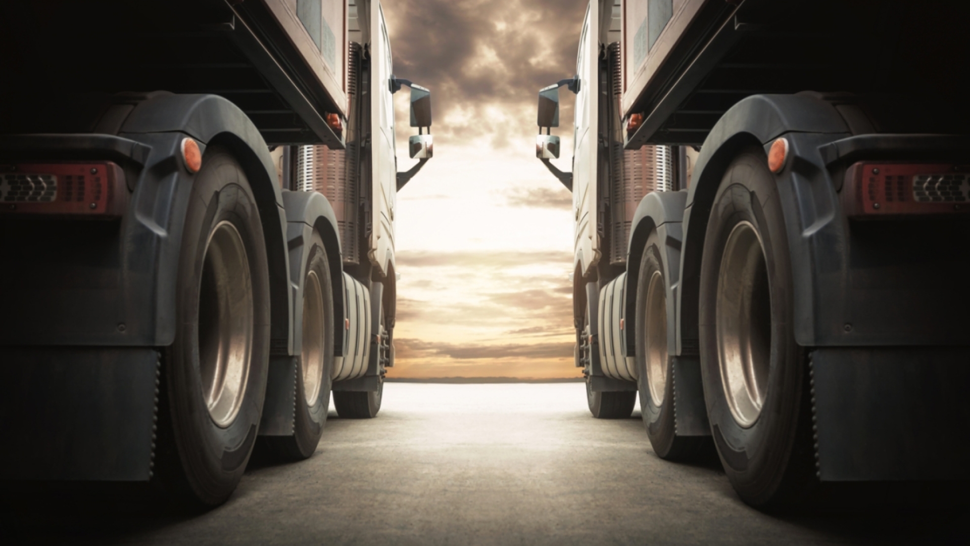 two semi trucks parked