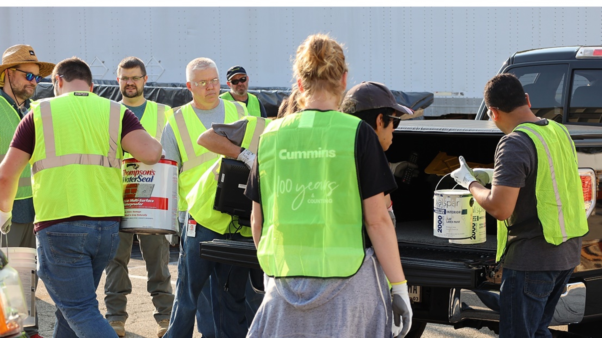 Cummins employees at the Columbus Engine Plant unload waste paint at a community recycling day at the plant earlier this year.