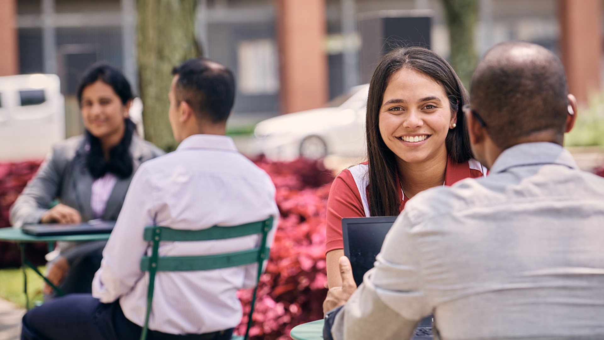 Employees engaging in friendly discussion outside