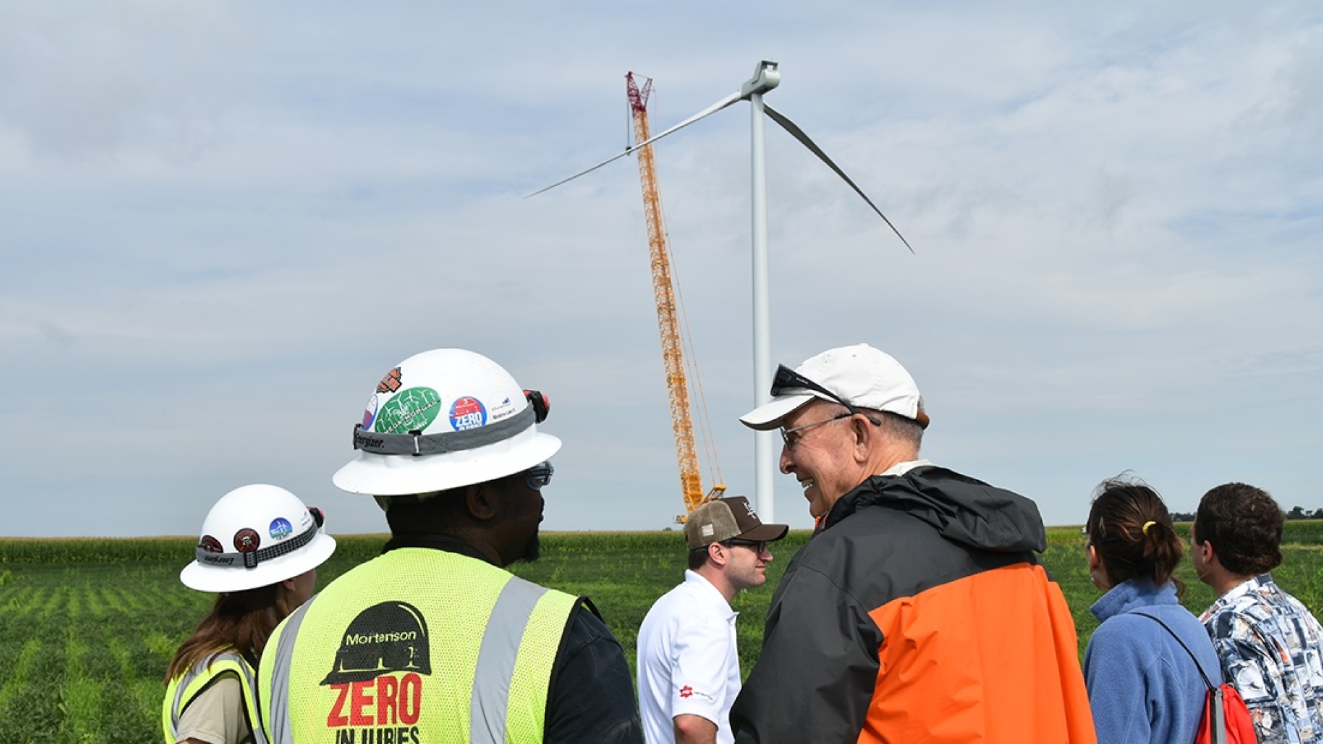 Visitors to the Meadow Lake Wind Farm in northwest Indiana look at one of the first wind turbines to go up at an expansion Cummins is supporting through a Virtual Power Purchase Agreement. When complete in early 2019, the expansion will include more than 50 wind turbines and a capital investment of about $340 million.