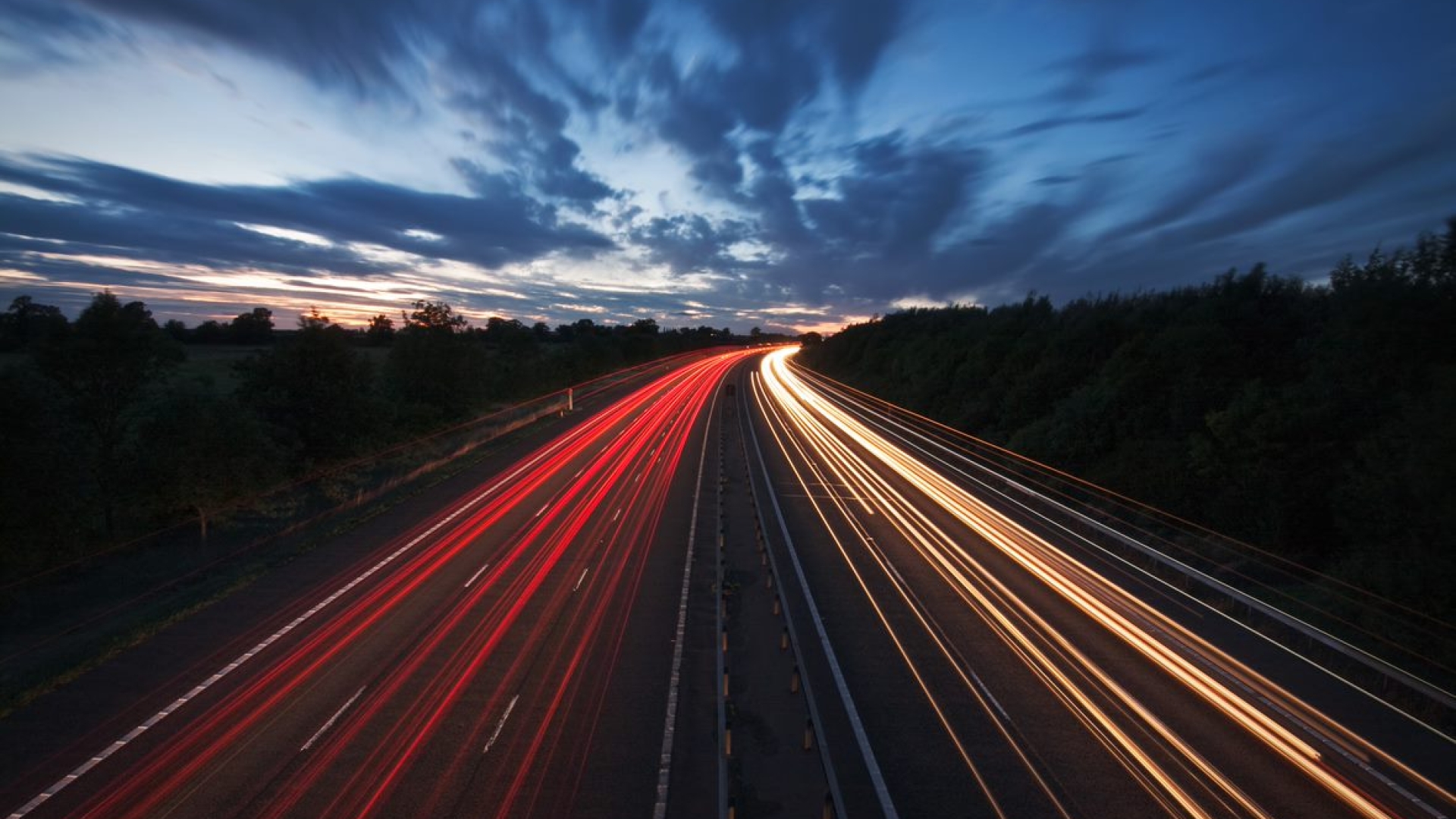 highway after dark with time elapsed vehicle lights