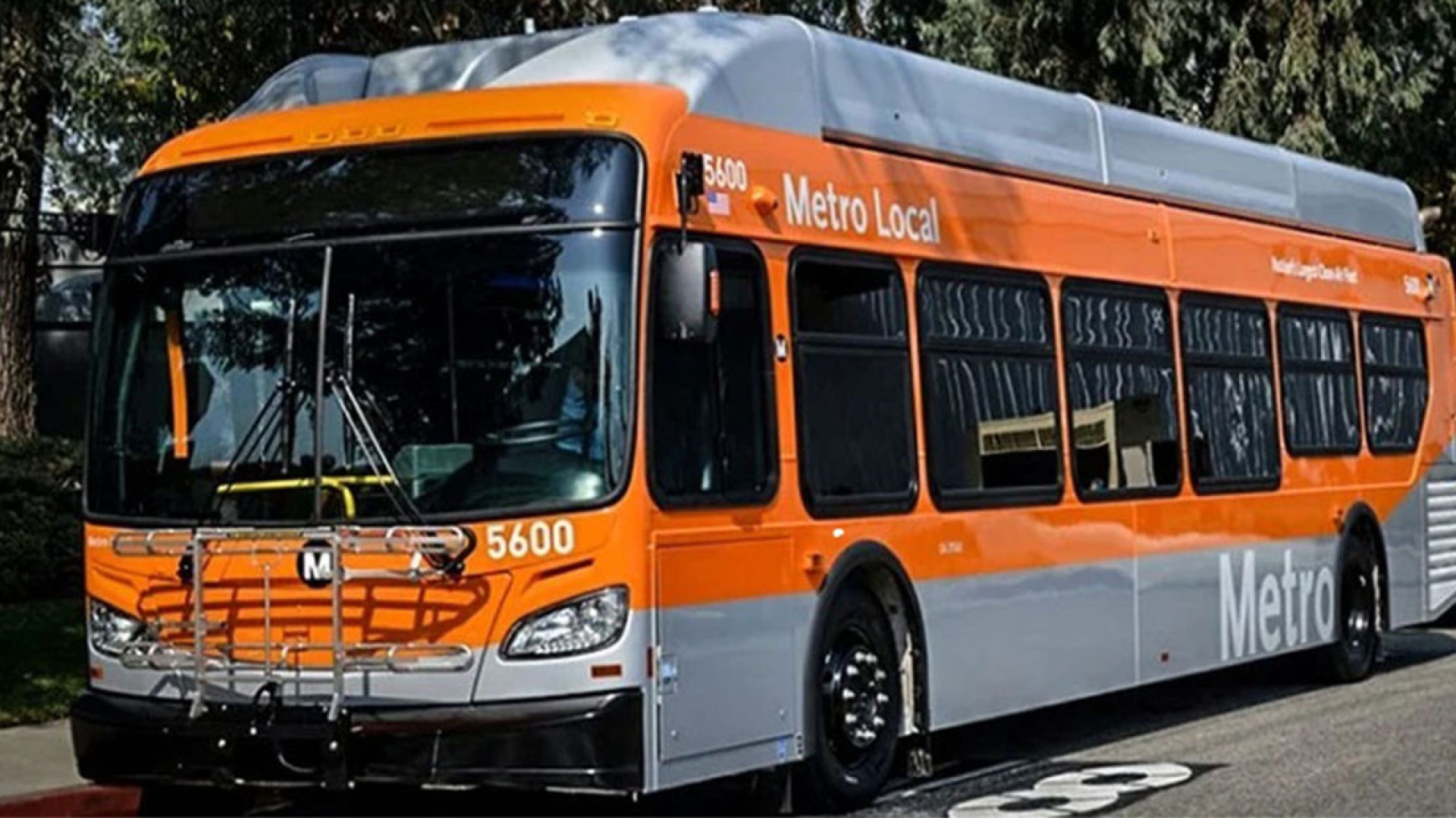 Orange and grey Metro Local bus parked
