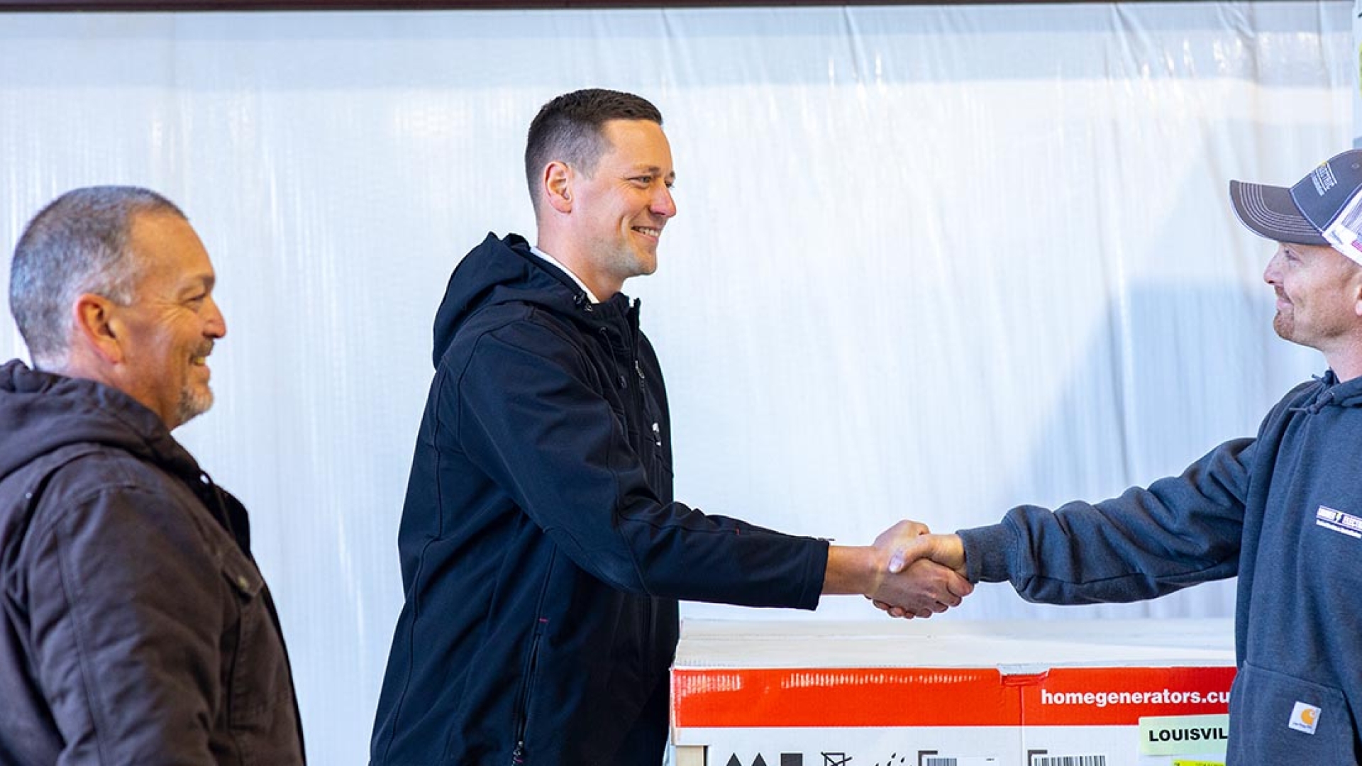 HSB dealer shaking hands with Cummins representative