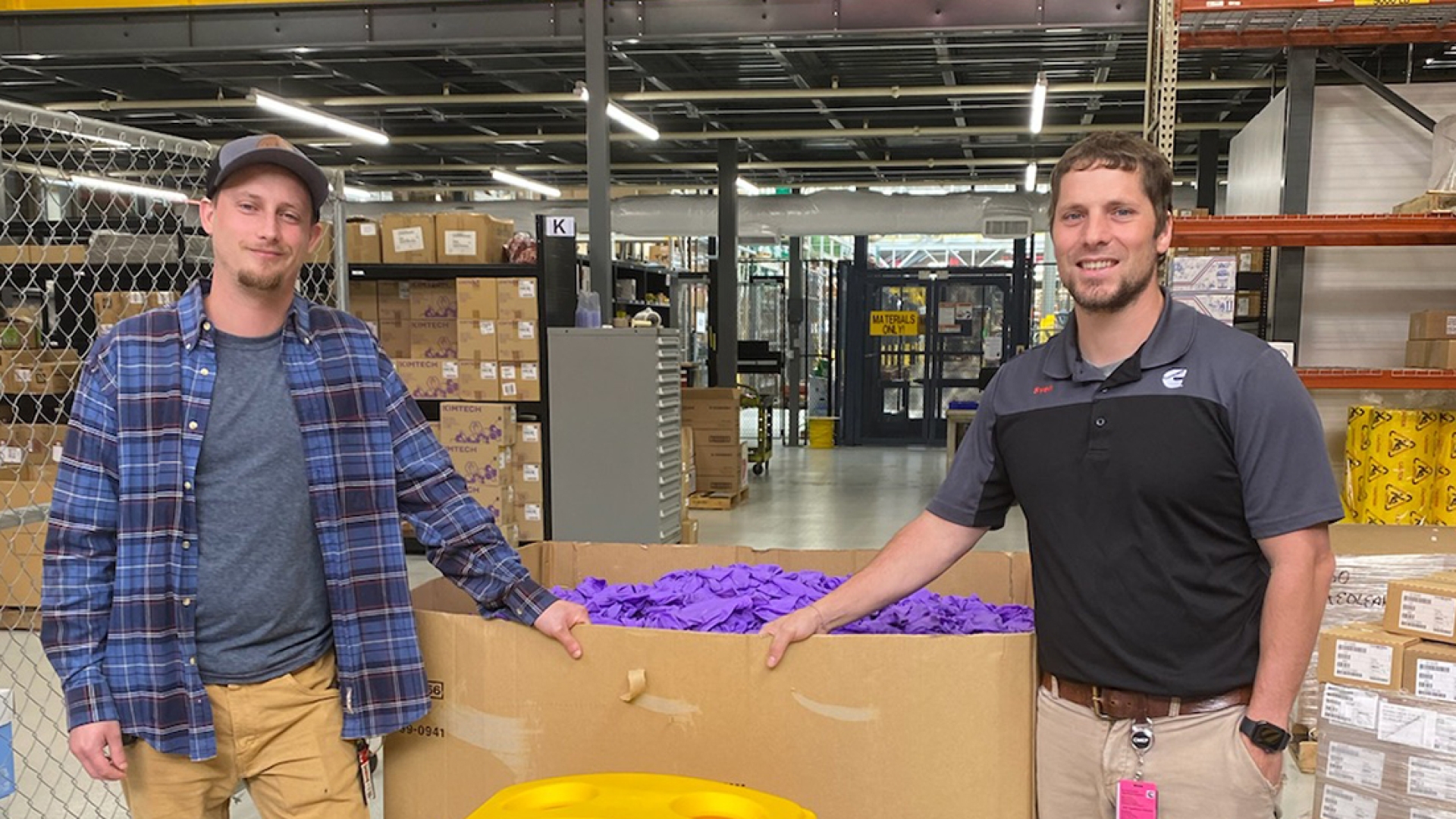 employees in front of gloves
