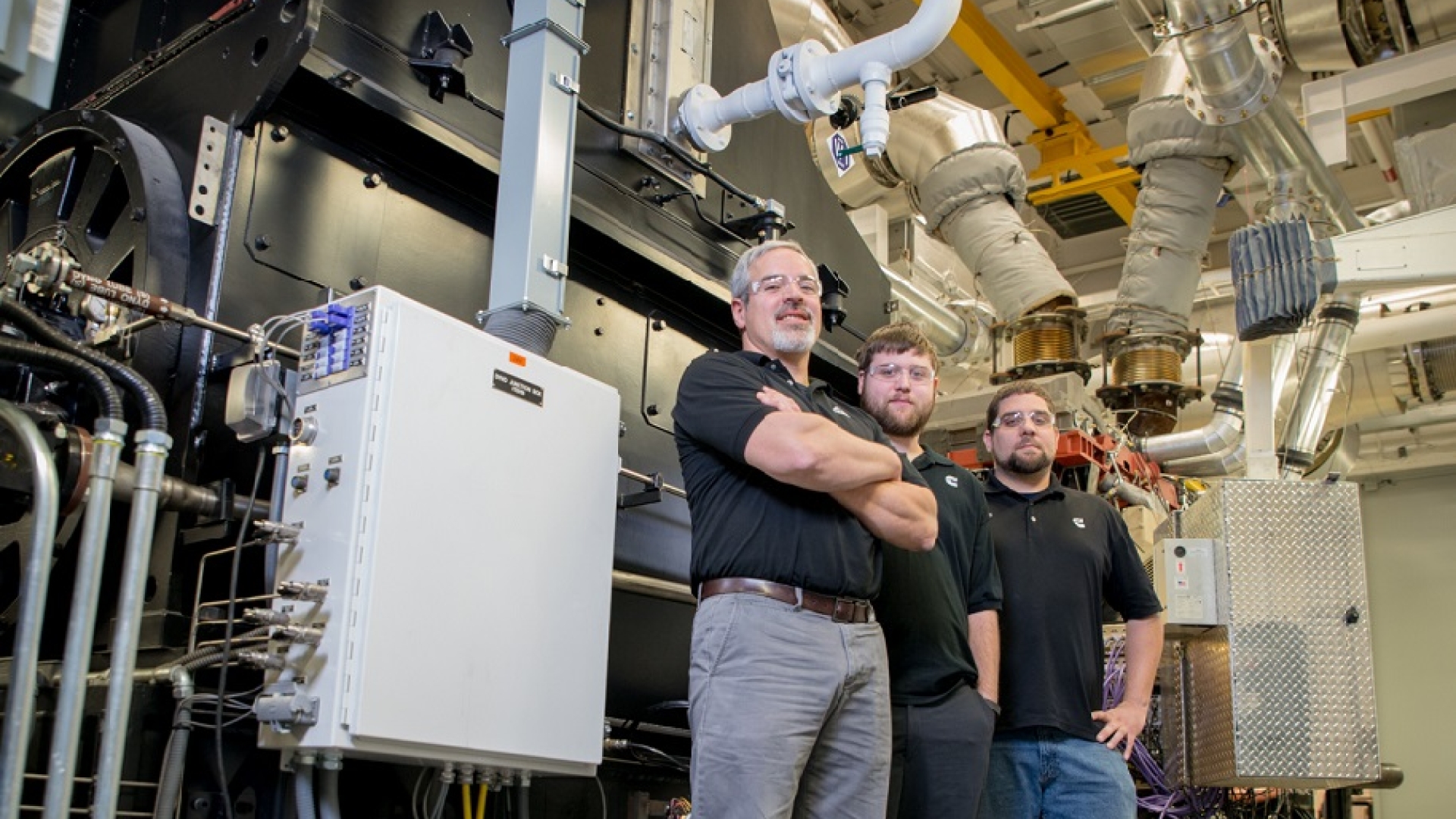 Cummins teams like this one in Seymour, Indiana (USA) are using regenerative dynamometers (behind them) to capture the energy generated testing engines to help power to the company’s plants.