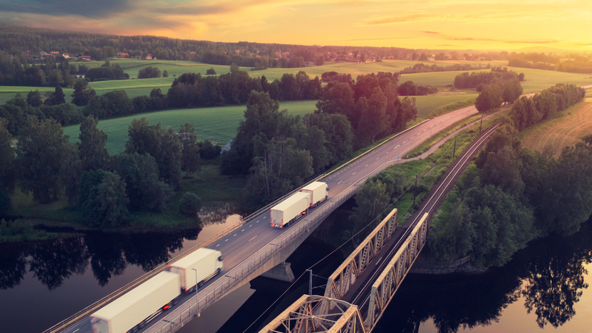 semi trucks on highway bridge
