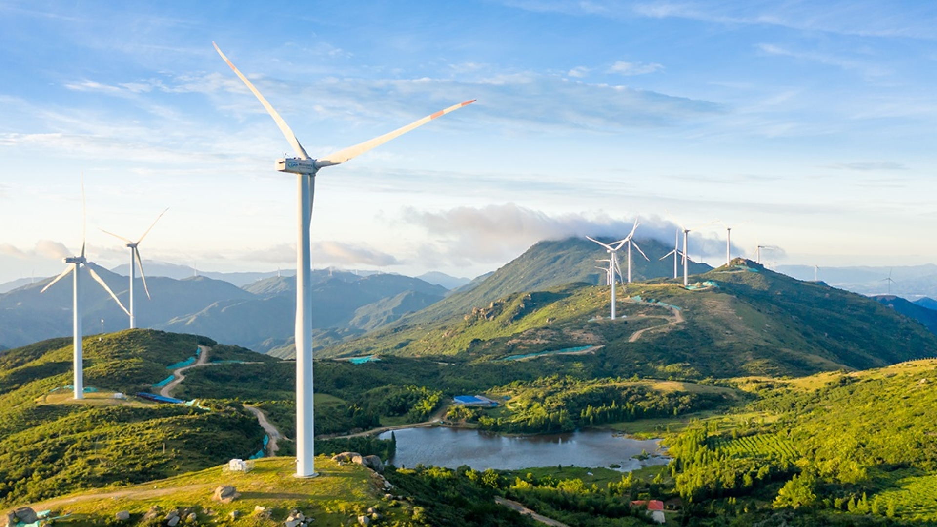 A windfarm across a mountainous landscape