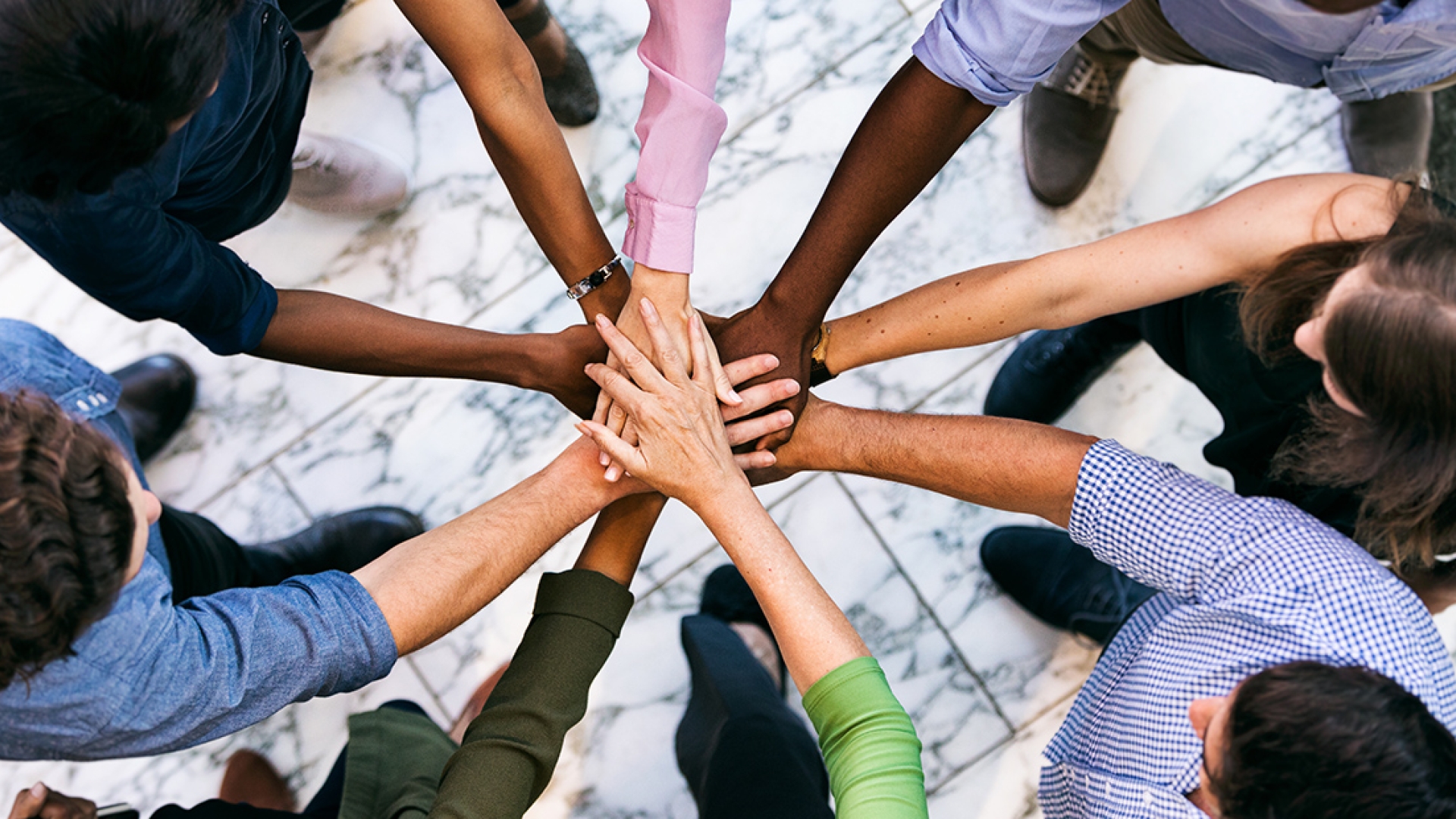 team huddle with hands