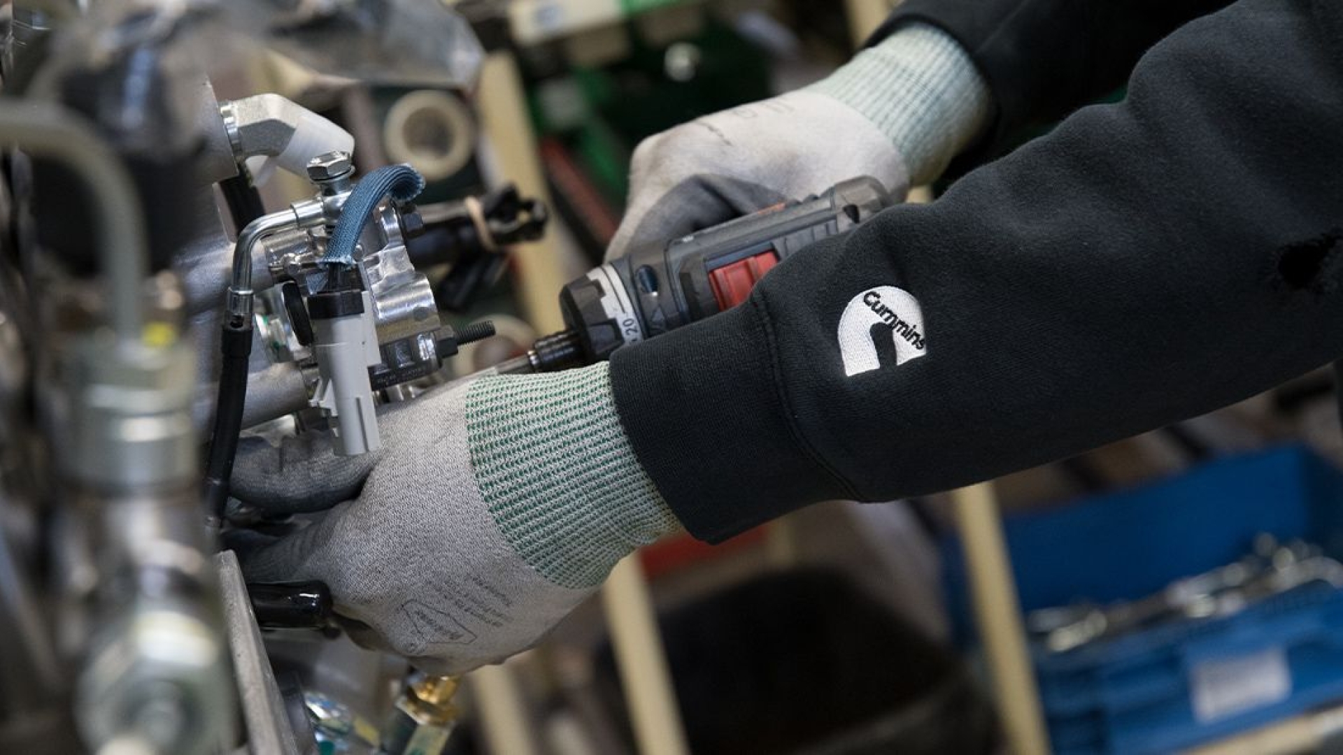 mechanics hand work on engine