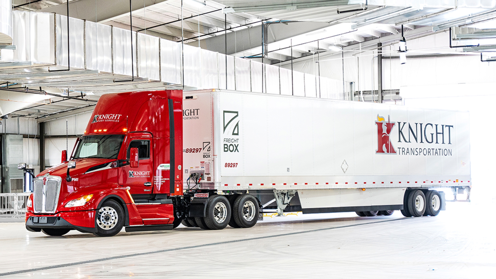 Knight-Swift semi truck parked in a garage
