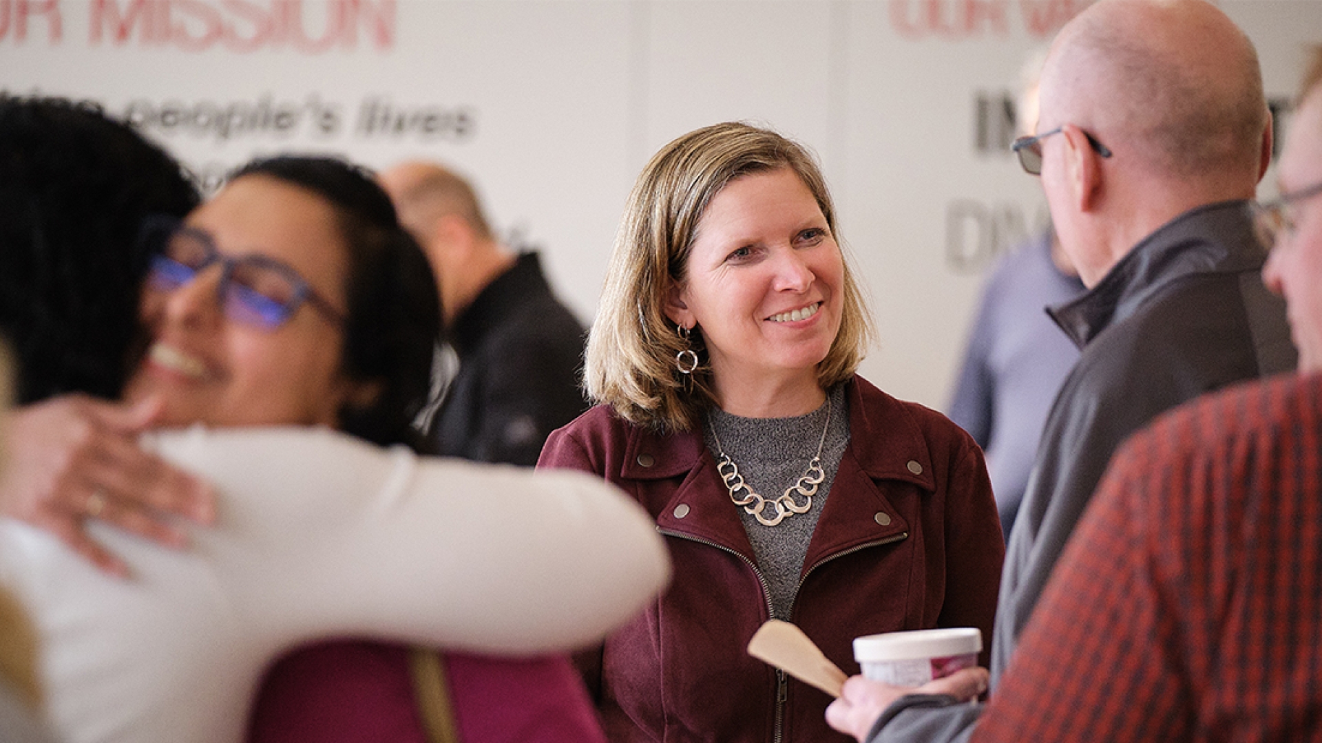 Jen Rumsey talking to employees